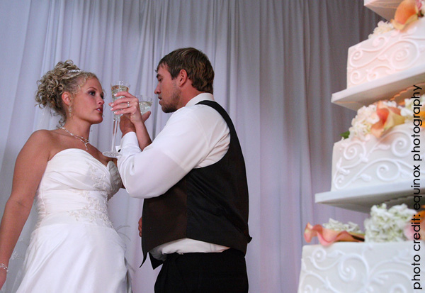 bride and groom toasting what wedding traditions should you keep?