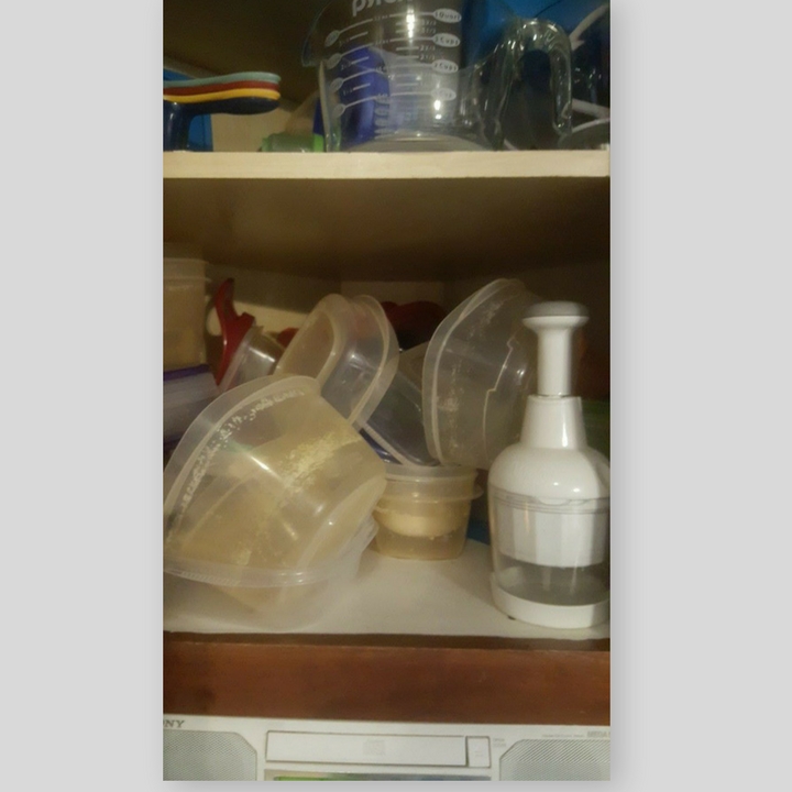 messy tupperware cabinet