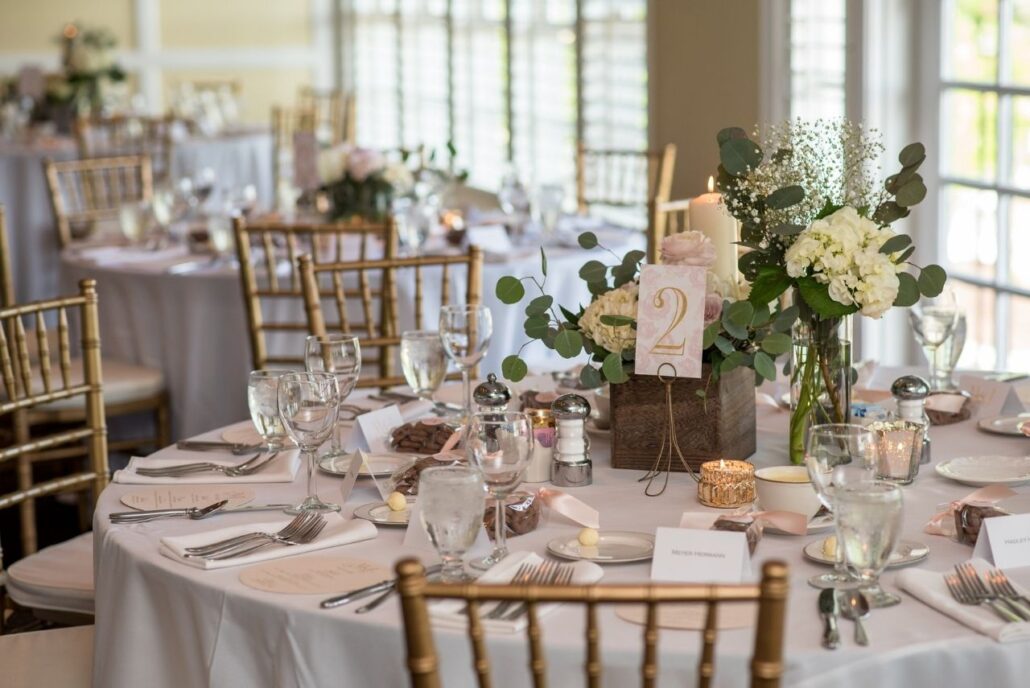 soft blush and greenery reception centerpiece evansville country club