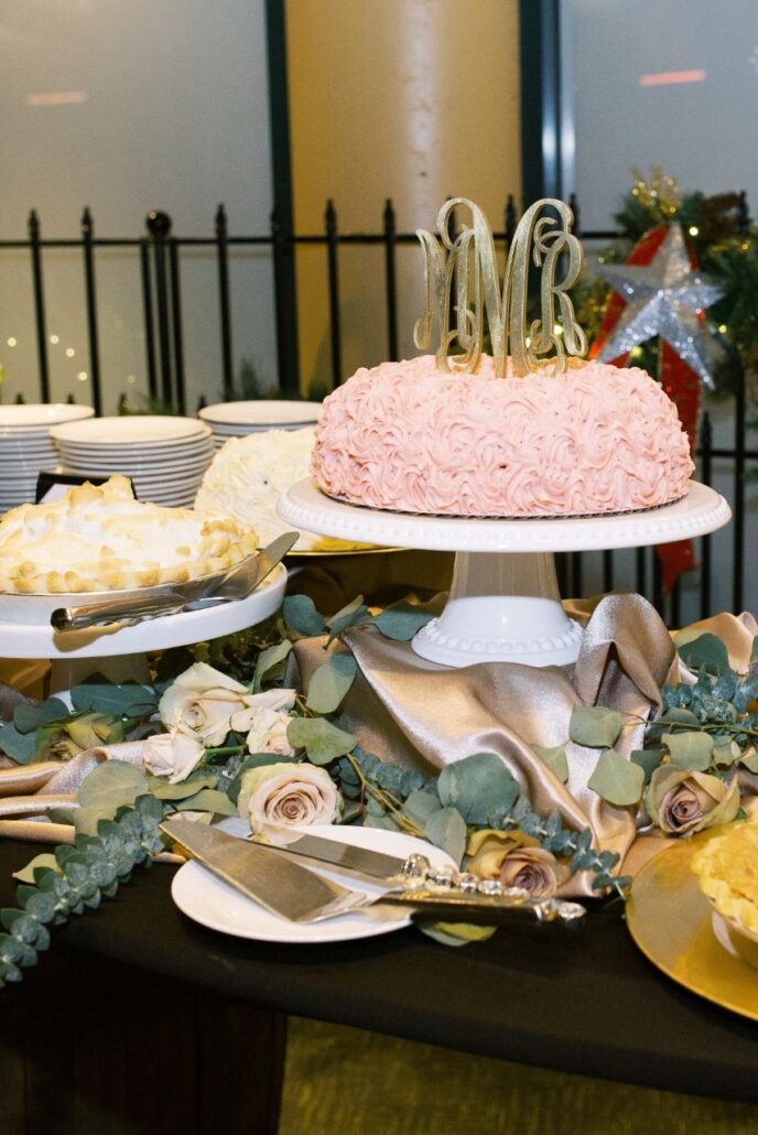 wedding dessert table of cakes and pies