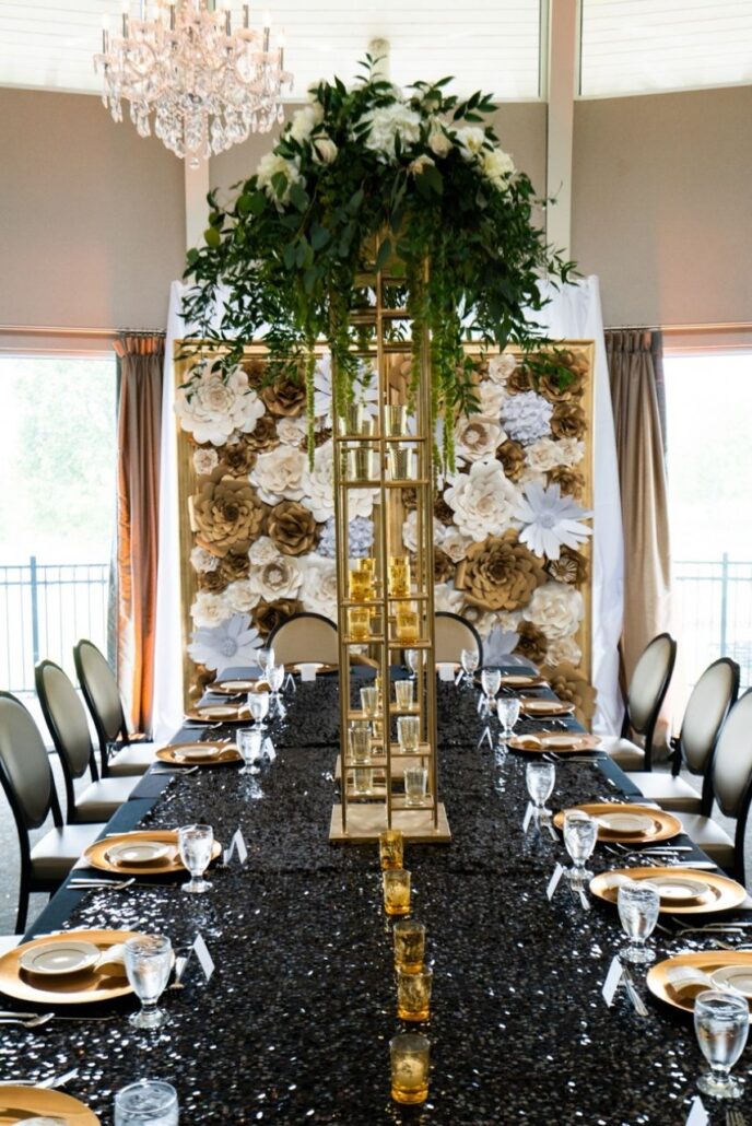 black sequin tablecloth and gold centerpieces