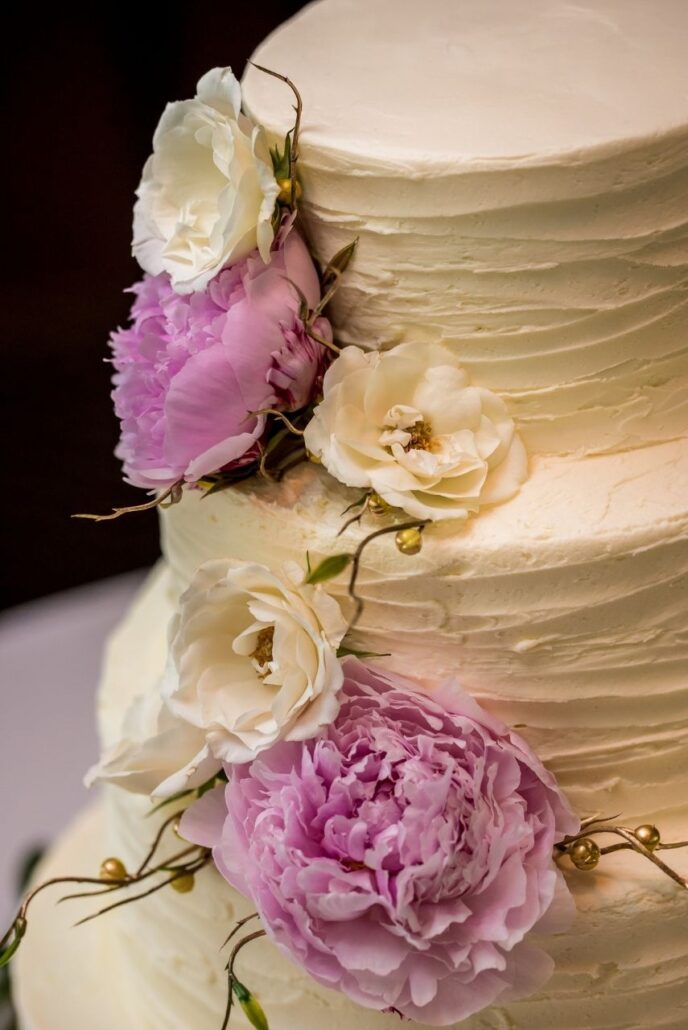 wedding cake with pink and white peonies