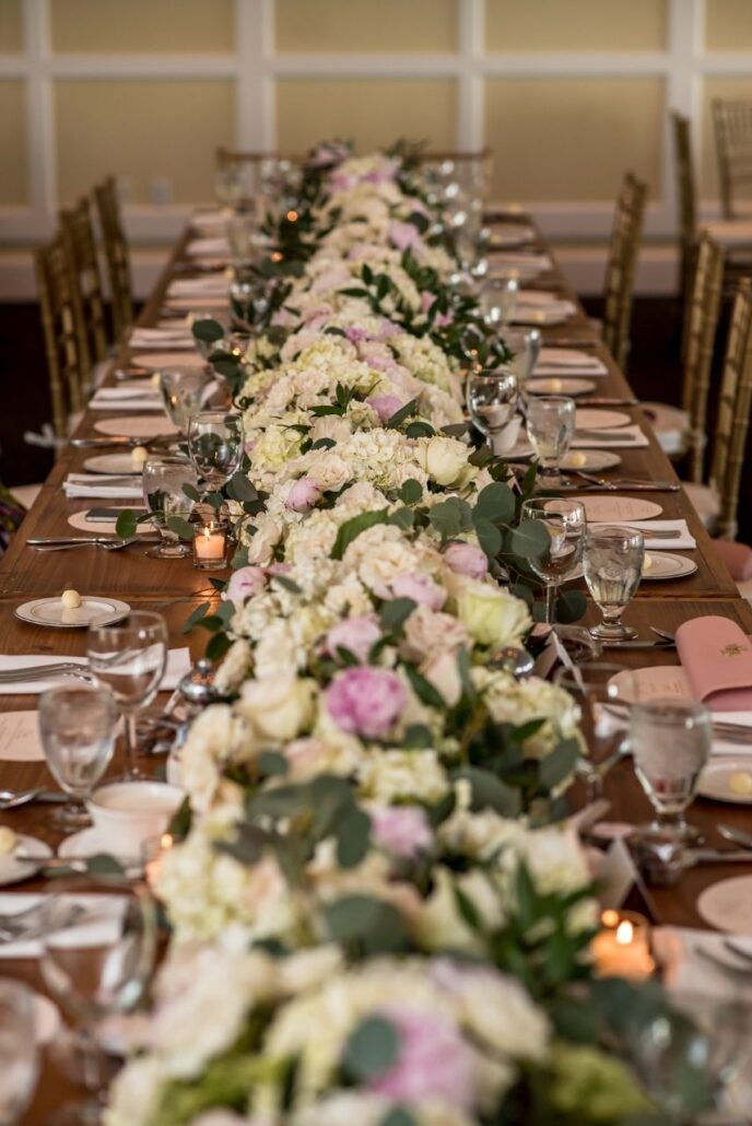 floral garland on harvest table at evansville country club