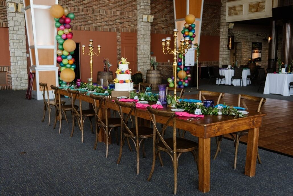 harvest table at wedding with colors