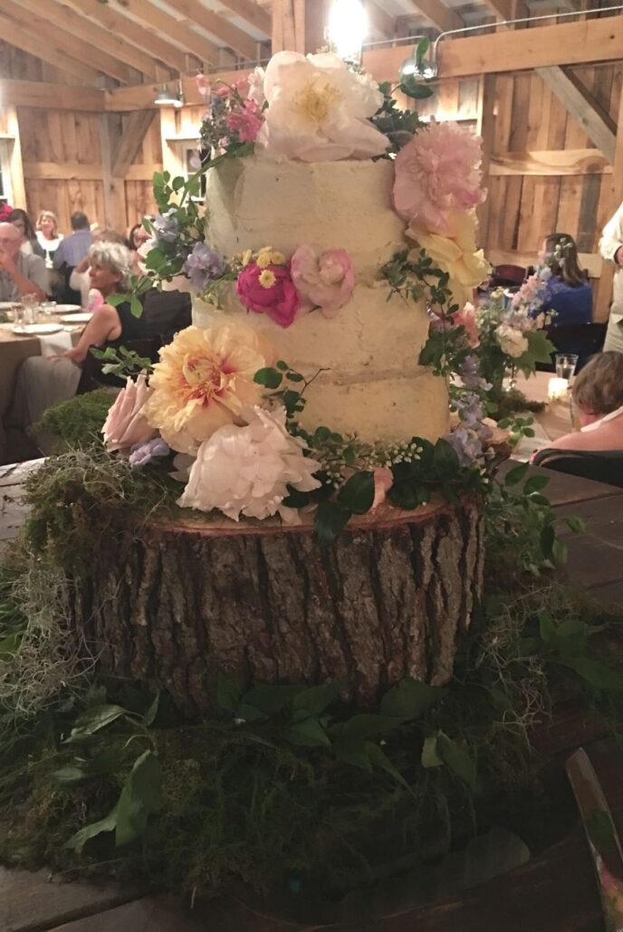 wedding cake on wood log